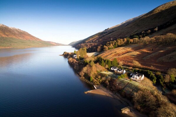 A lakeside property with a house and a dock. - 3 Bed in Letter Finlay (oc-l30952) (Altura)