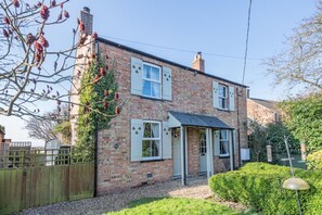 A two-story brick house with a small porch and a garden. - 2 Bed in Welney (oc-o30872) (Welney)