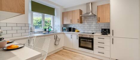 Microwave, oven, cookware/dishes/utensils