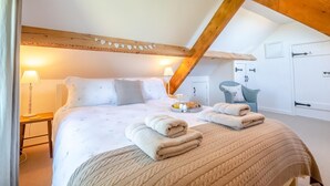 A bedroom with a bed, bedside lamps, a chair, and a wardrobe. - 1 Bed in Ravenscar (oc-p30830) (Fylingdales)