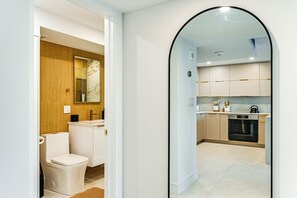 A modern kitchen with a built-in oven and a microwave. - Walk to Beach: Luxe Harbor-View Condo in Naples! (Naples)