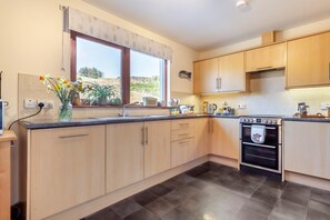 Oven, dishwasher, high chair, cookware/dishes/utensils