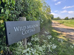 A sign for Wild Meadow Cottage. - 5 Bed in Postwick (oc-w30947) (Postwick)