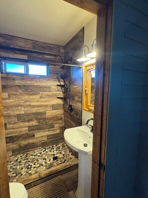 Shower, towels, soap, toilet paper