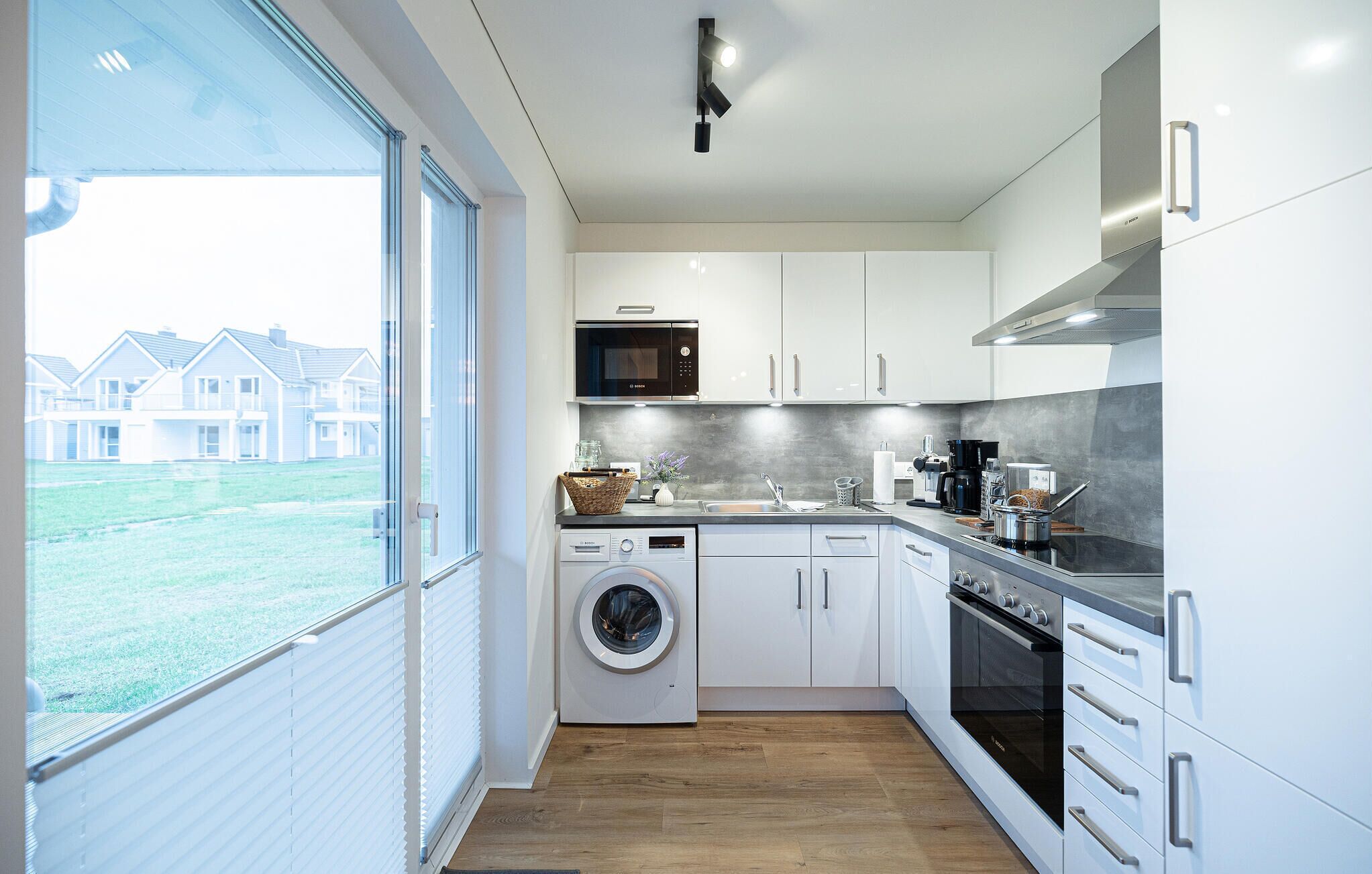 Fridge, stovetop, dishwasher, coffee/tea maker