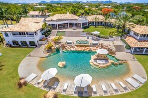 A resort with a large pool, multiple buildings, and a well-maintained lawn. - Sandyline   Private Paradise   Resort Style Villa (Saint Martin)