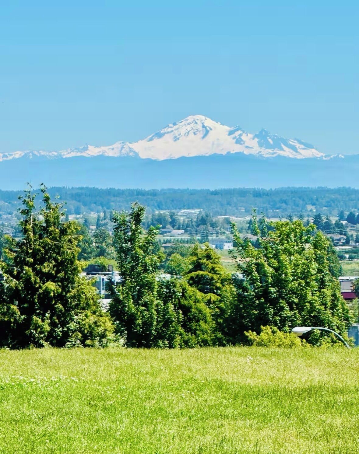 A mountain with a clear sky in the background.