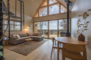 TV, fireplace - The Ffern * Modern Cabin Farm Retreat + Hot Tub (Logan)
