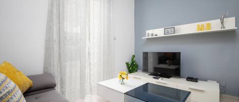 Apartamento, 2 quartos, cozinha | Área de estar