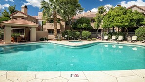 A swimming pool with a lounge area, palm trees, and a covered seating area. - Villa Antigua with Resort-Style Pool, Spa, Tennis in Scottsdale Old Town (Scottsdale)