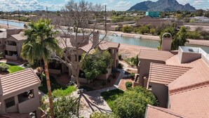 A residential area with multiple buildings, a swimming pool, and a river. - Villa Antigua with Resort-Style Pool, Spa, Tennis in Scottsdale Old Town (Scottsdale)