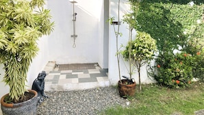 A small outdoor area with a shower, potted plants, and a statue. - Possibly the best private pool in Pampanga - all yours, no sharing (Magalang)