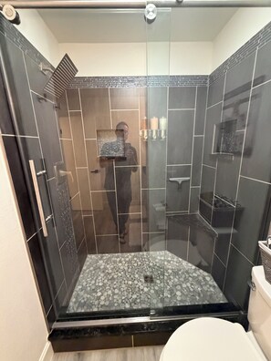 Shower, eco-friendly toiletries, hair dryer, towels