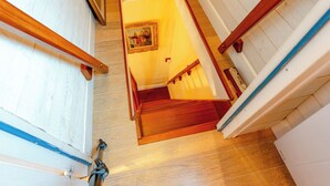 A wooden staircase with a handrail, leading to a lower level. - Apartment Cigale by Interhome (Deauville-Trouville)