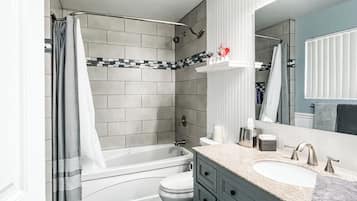 Secadora de cabello, toallas, jabón, papel de baño
