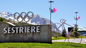 A sign with the Olympic rings and the word "SESTRIERE" in front of a mountain backdrop. - Champlas Suite - Balcony Views, Sleeps 4, Sestriere, Italy (Sestriere)