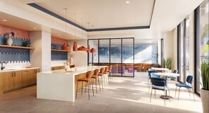 A modern kitchen with a central island, bar stools, and pendant lighting.