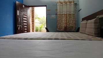 Classic Quadruple Room, Garden View | Living area | 42-inch Smart TV with digital channels, streaming services