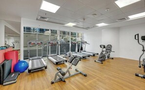A gym with treadmills, elliptical machines, and exercise balls. - Skyline / Balcony / Waterfront & Marina Walk (Dubai)