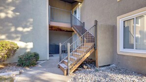 A multi-level apartment building with a staircase leading to a balcony. - Pet-Friendly Condo w/ Mountain View in Monument! (Monument)