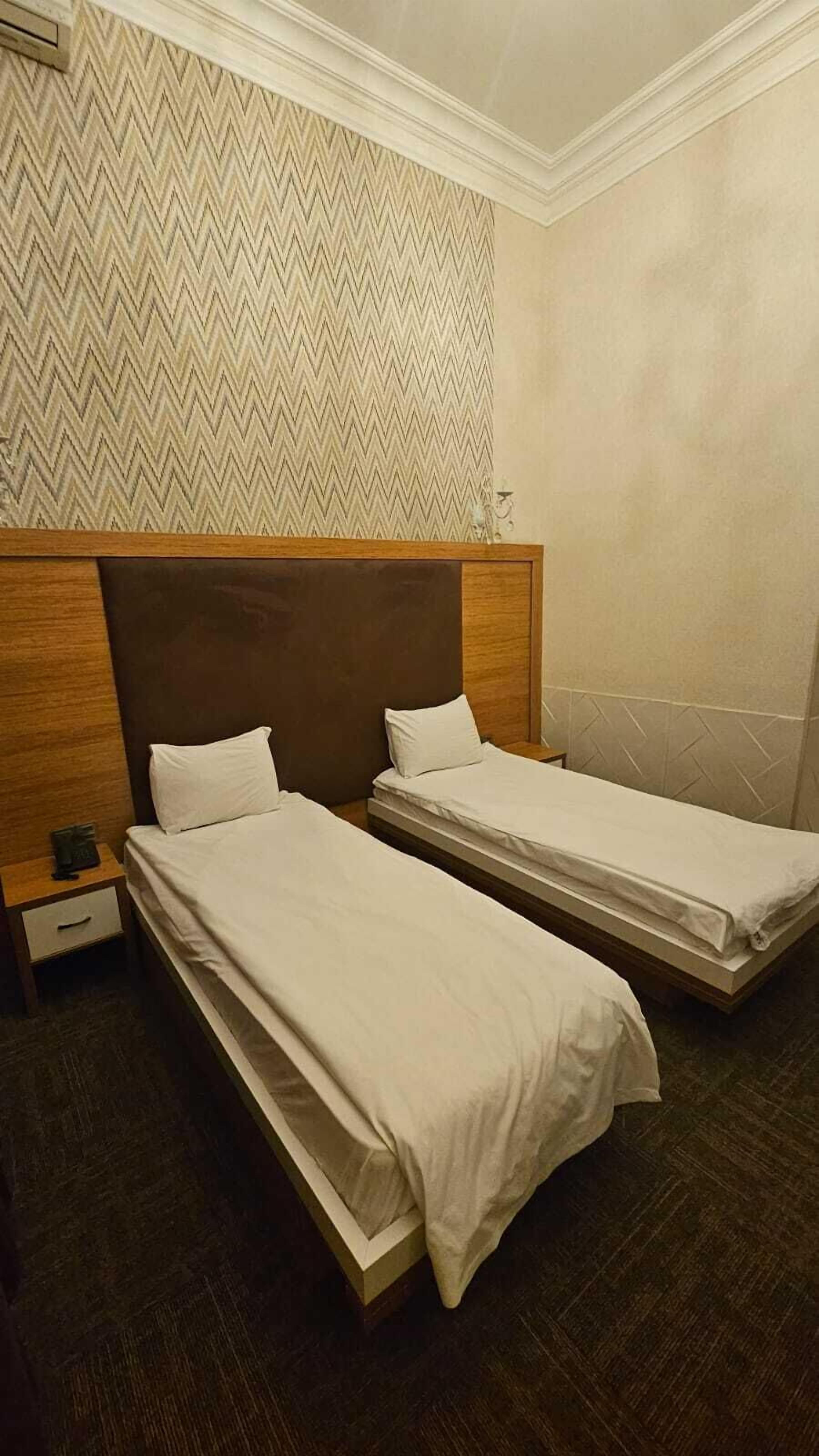 Quarto duplo standard, vista para a cidade | Área de estar