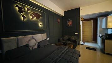 Luxury Studio Suite, Balcony, City View | In-room safe, desk, laptop workspace, blackout curtains