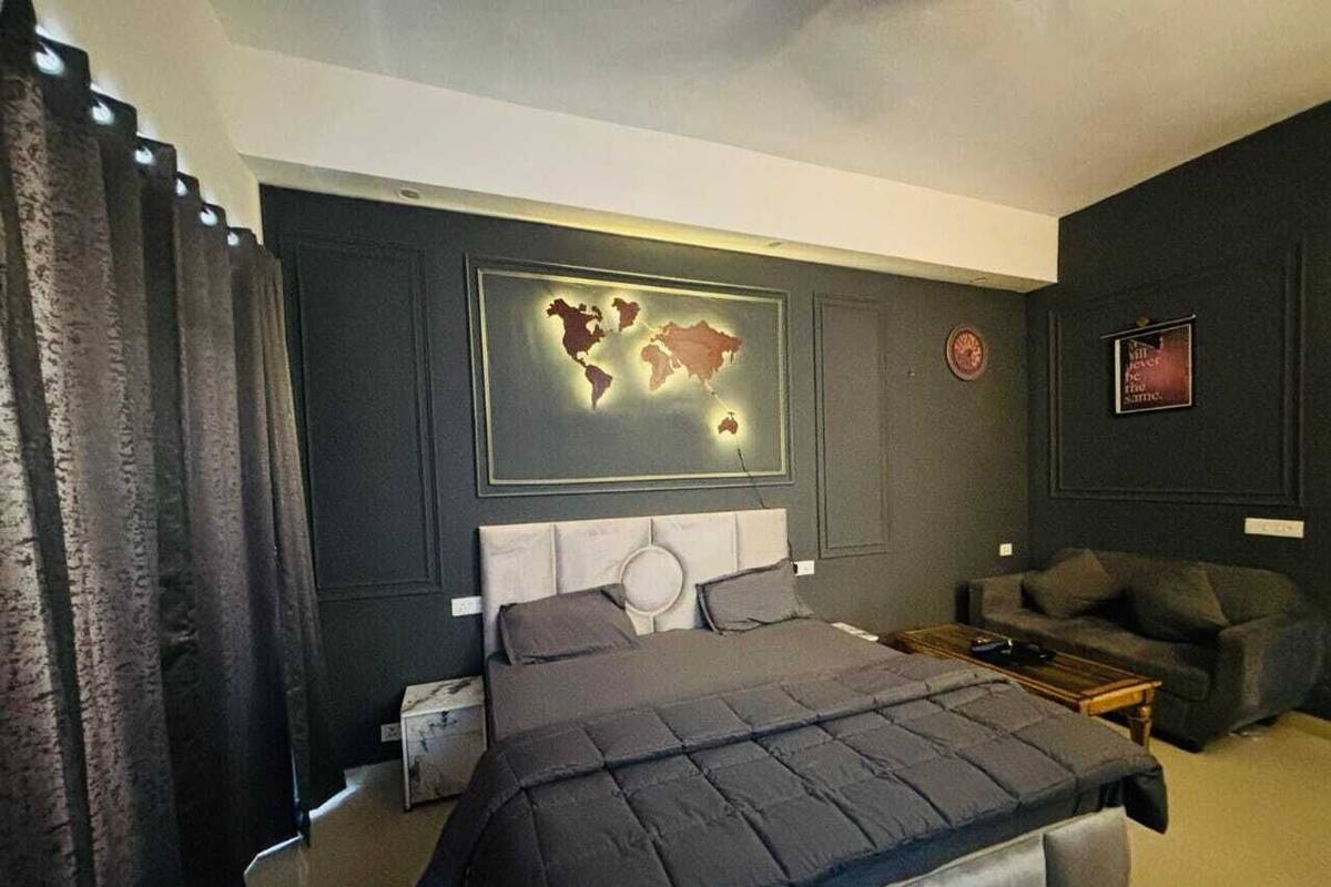 Luxury Studio Suite, Balcony, City View | In-room safe, desk, laptop workspace, blackout drapes