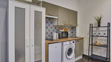 Fridge, microwave, stovetop, coffee/tea maker