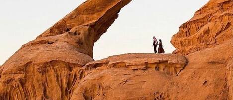 A natural rock formation with an arch.