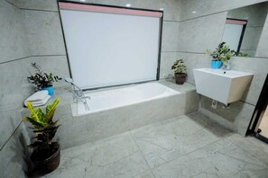 Presidential Room, City View | Bathroom | Shower, free toiletries, towels, soap - Premier Somnath (Somnath)