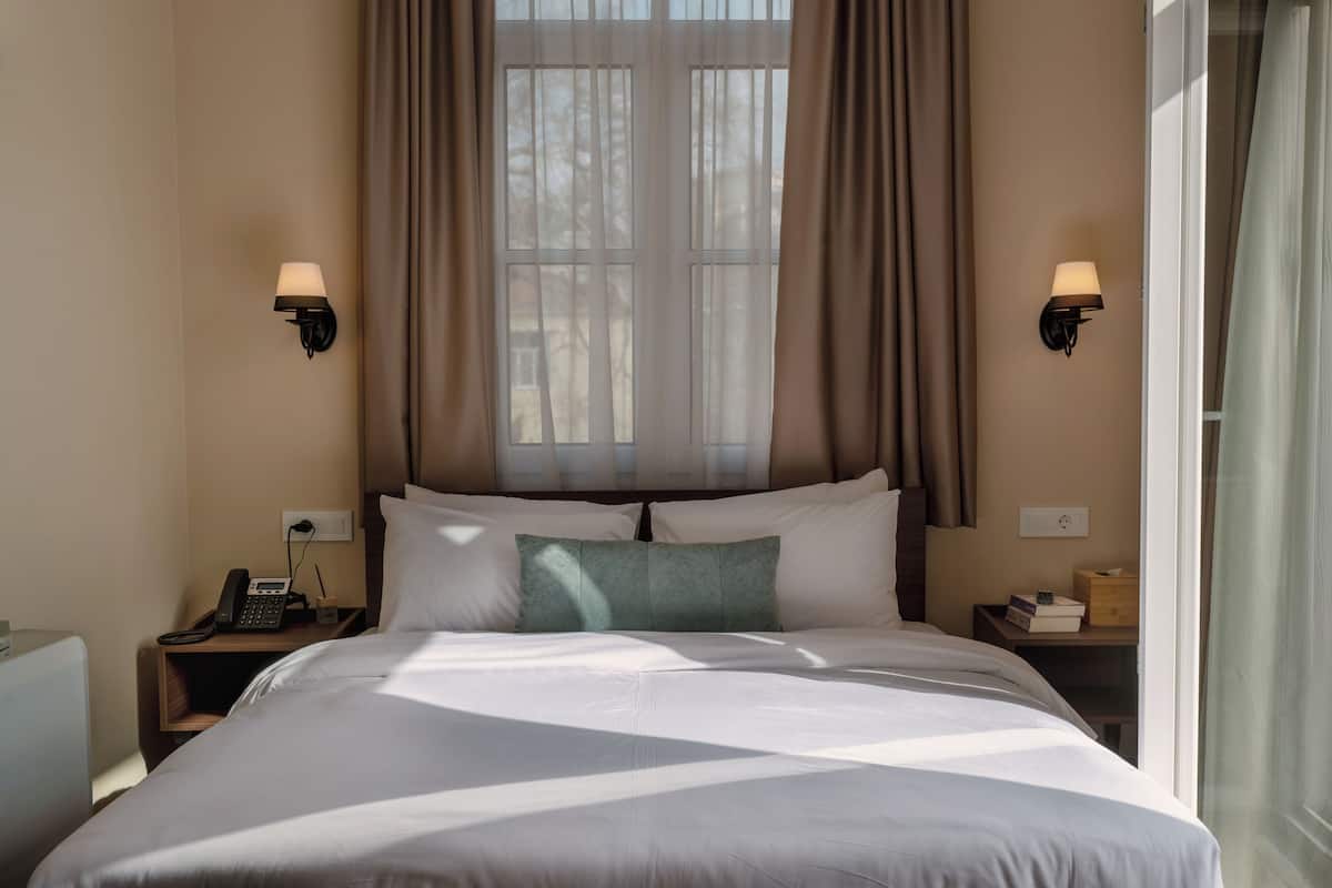 Superior Double Room, Balcony | In-room safe, desk, laptop workspace, blackout drapes