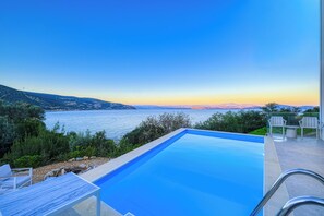 Outdoor pool, a heated pool - A luxurious specious 4 bedroom 3.5 bathrooms sea front modern villa (XIROPIGADO)