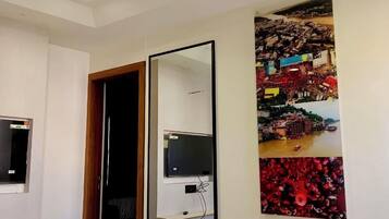 Deluxe Triple Room | In-room safe, desk, laptop workspace, blackout curtains