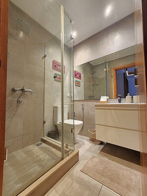 Shower, hair dryer, towels, soap