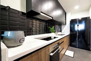 Presidential Suite, 2 Bedrooms, Club Lounge Access, City View | Private kitchen | Full-size fridge, microwave, oven, stovetop - Vivian Boutique Delasol Residence (Vinh Hoi)