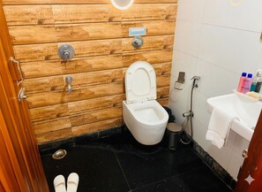 Family Double Room, Balcony | Bathroom | Eco-friendly toiletries, slippers, towels, soap - Hotel Church House - Rohini I Near Metro I Specious Rooms I Friendly Staff I Most Preferred Hotel In Rohini (New Delhi)