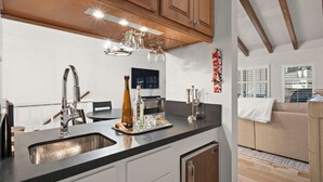 A modern kitchen with a large island, stainless steel appliances, and wooden cabinets. - 3BR/2.5BA Incline Village condo, pool, fireplace (Incline Village)