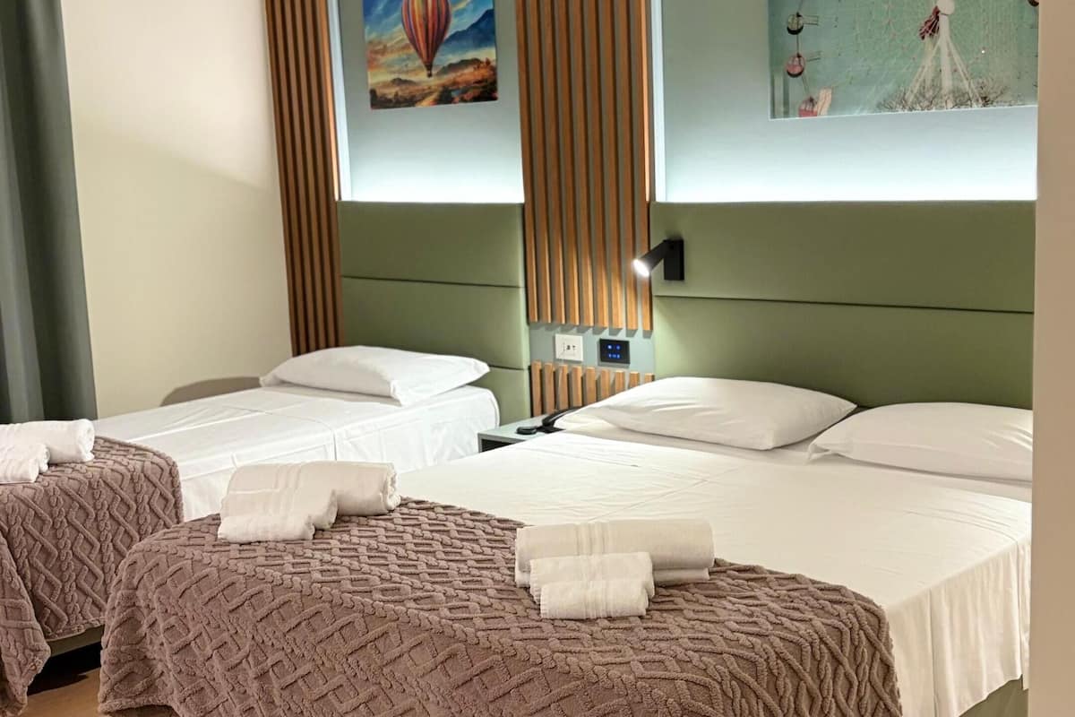 Deluxe Triple Room, Balcony, City View | In-room safe, desk, blackout drapes, soundproofing