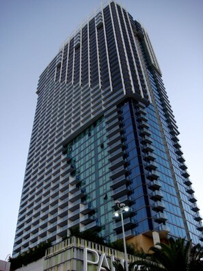 A tall, modern building with a grid-like facade and balconies. - Studio • Balcony • No Resort Fee • Free Parking • WN34 (Las Vegas)