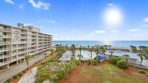 A hotel with multiple floors, a swimming pool, and a beach view. - B407- Beautifully renovated waterfront condo! Incredible Beach Rates :) (Panama City)