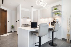 Luxury Apartment, Balcony, City View | Private kitchen - Sobha Suites by Hostiva - Burj View (Dubai)