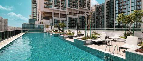 Outdoor pool, open 7:00 AM to 10:00 PM, pool umbrellas, pool loungers
