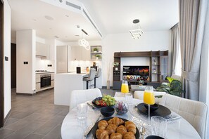Luxury Apartment, Balcony, City View | Living area - Sobha Suites by Hostiva - Burj View (Dubai)