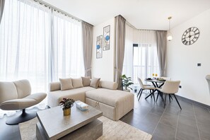 Luxury Apartment, Balcony, City View | Living area - Sobha Suites by Hostiva - Burj View (Dubai)