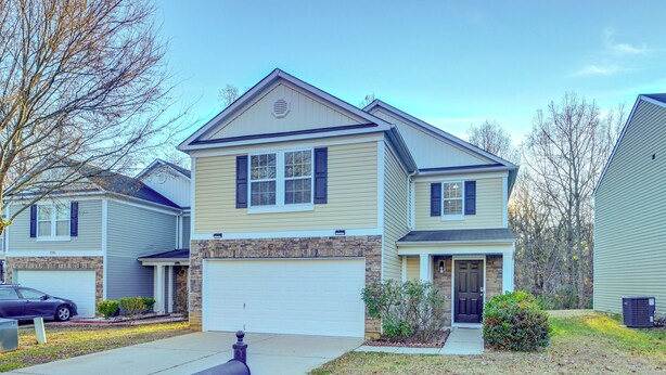 A two-story house with a garage, a front porch, and a mailbox. - 4BR Pet-friendly Charlotte Home 6 Mi to CLT (Charlotte)