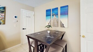 A dining area with a table, chairs, a plant, and a door with a 'DO NOT ENTER' sign. - Pool Access! Dog-friendly Retreat 16 Mi to Orlando (Longwood)