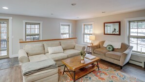 A living room with two sofas, a coffee table, and a rug. - 5 Mi to Mt Snow: Secluded Family Home w/ Game Area (West Dover)
