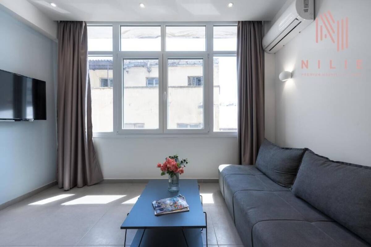 Apartamento standard | Área de estar | Smart TV