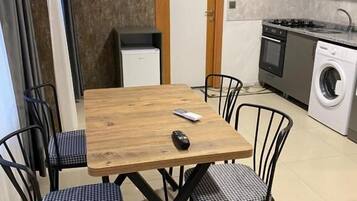 Two-Bedroom Apartment with Terrace | Private kitchen | Fridge, microwave, oven, stovetop