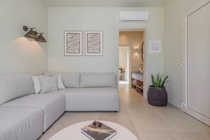 Suite junior, vistas a la ciudad | Zona de estar